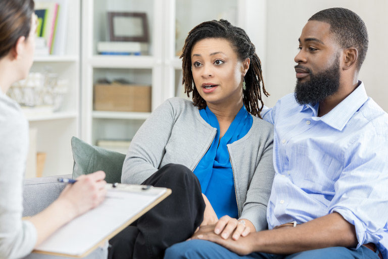 Couple having conversation with doctor