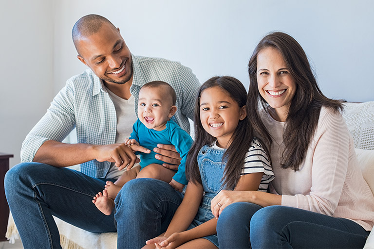 Couple with two children, a young daughter and infant son