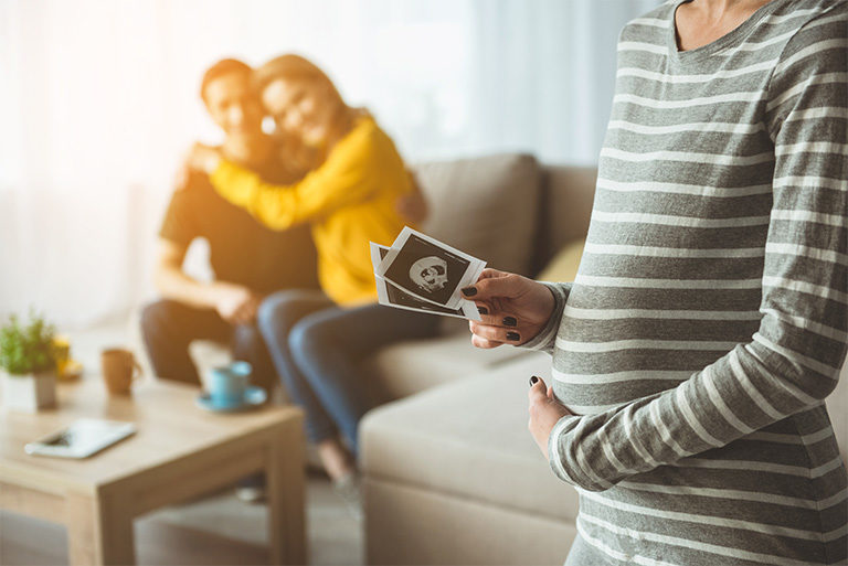 Couple with woman who is gestational carrier