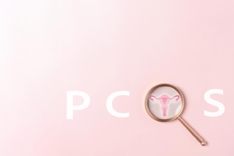 PCOS with magnifying glass as the O with a graphic of a uterus